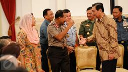 Menko Polhukam Luhut Binsar Panjaitan (kanan), Kapolri Jenderal Pol Badrodin Haiti dan putri alm Gus Dur, Yenny Wahid terlihat menghadiri acara peringatan Hari Hak Asasi Manusia (HAM) di Istana Negara, Jakarta, Jumat (11/12). (Liputan6.com/Faizal Fanani)