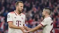 Penyerang Bayern Munchen, Harry Kane, melakukan selebrasi setelah mencetak gol keempat FC Hollywood ke gawang Dinamo Zagreb, Rabu (18/9/2024) dini hari WIB. Kane mengalahkan catatan manis Wayne Rooney di panggung Liga Champions (AFP / Alexandra Beier)