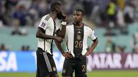 Youssoufa Moukoko. Striker Timnas Jerman yang bermain di Borussia Dortmund ini menjadi pemain termuda yang telah melakukan debutnya di matchday pertama fase Grup E Piala Dunia 2022 saat diturunkan pelatih Hansi Flick menghadapi Jepang pada menit ke-90 menggantikan Serge Gnabry (23/11/2022). Saat itu ia baru berusia 18 tahun dan 3 hari. Sayang, debutnya harus berakhir dengan kekalahan 1-2 dari Jepang. (AP/Matthias Schrader)