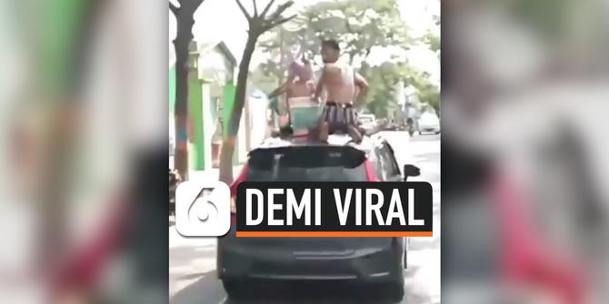 VIDEO : Lagi, Aksi 2 Pemuda Mandi diatas Mobil