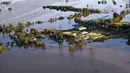Sebagian bangunan terendam banjir di daerah Windsor, barat laut Sydney, Australia, Rabu (24/3/2021).  Sekitar 18.000 penduduk negara bagian terpadat di Australia telah meninggalkan rumah mereka sejak pekan lalu, dengan peringatan banjir dapat berlanjut hingga April. (Lukas Coch/Pool Photo via AP)