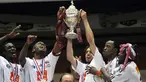 Guingamp's players hold their trophy after winning the French Cup final match Rennes versus Guingamp on May 9, 2009 at the Stade de France in Saint-Denis, outside Paris. AFP PHOTO FRANCK FIFE