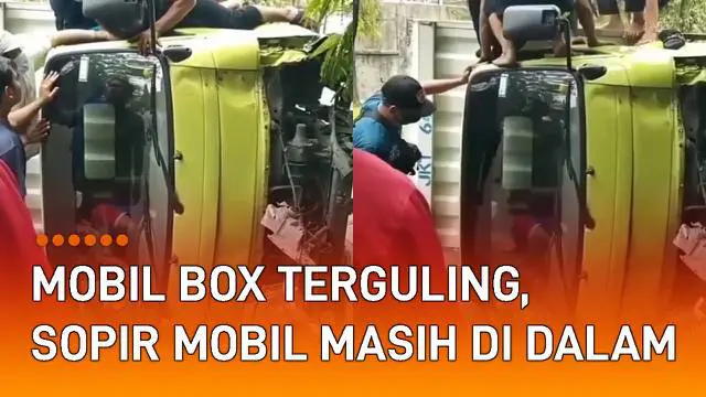 Sebuah mobil box terguling di jalan mengundang perhatian.