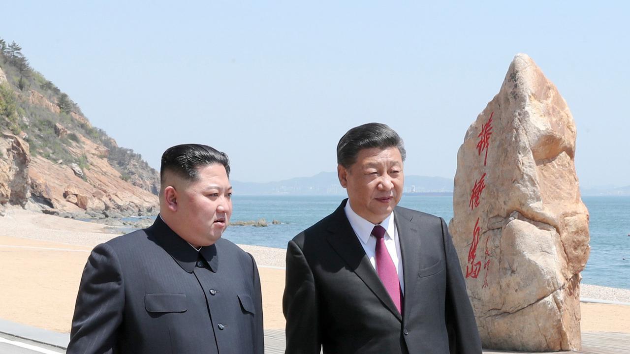 Xi Jinping dan Kim Jong-un