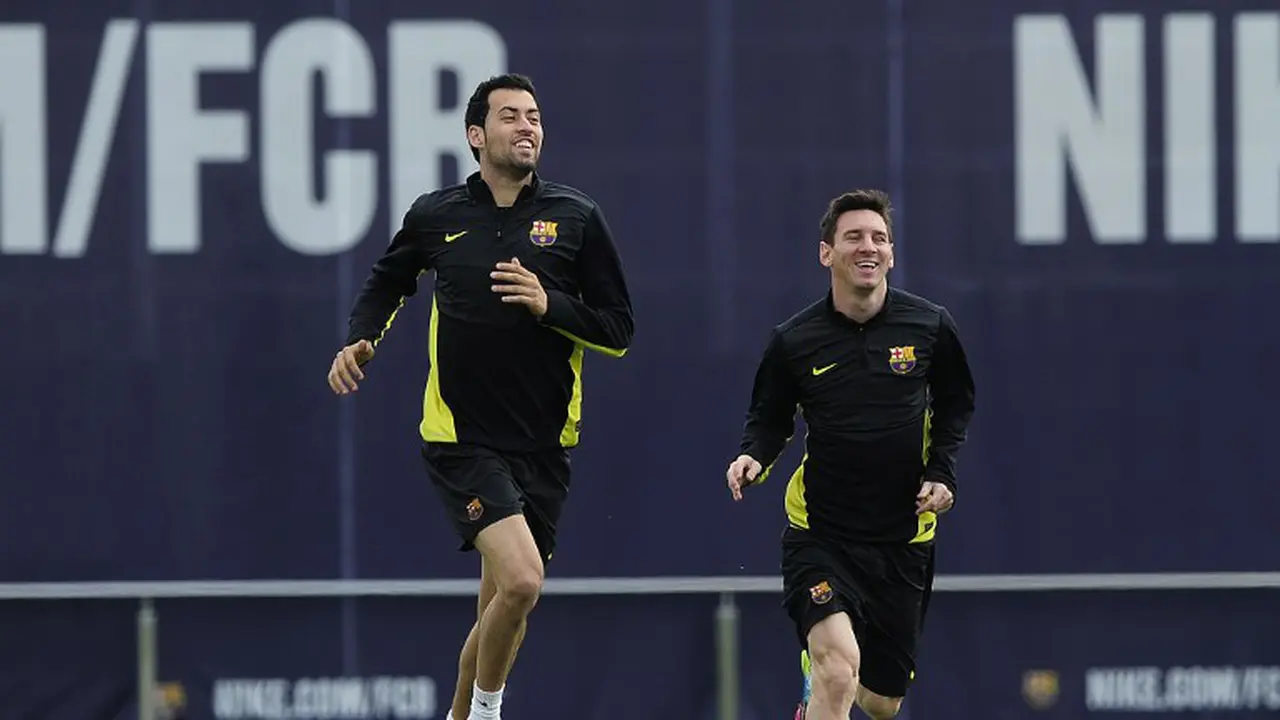 Sergio Busquets dan Lionel Messi 