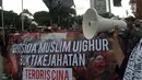 Masyarakat yang tergabung dalam Pembela Tauhid menggelar aksi solidaritas untuk muslim Uighur pada kegiatan Car Free Day di kawasan Bundaraan HI, Jakarta, Minggu (23/12). (Merdeka.com/Iqbal S. Nugroho)