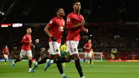 Penyerang Manchester United, Marcus Rashford, berhasil mencetak dua gol sekaligus membantu timnya menang 4-0 atas Norwich City pada laga pekan ke-22 Premier League, di Old Trafford, Sabtu (11/1/2020). (AFP/Oli Scarff)