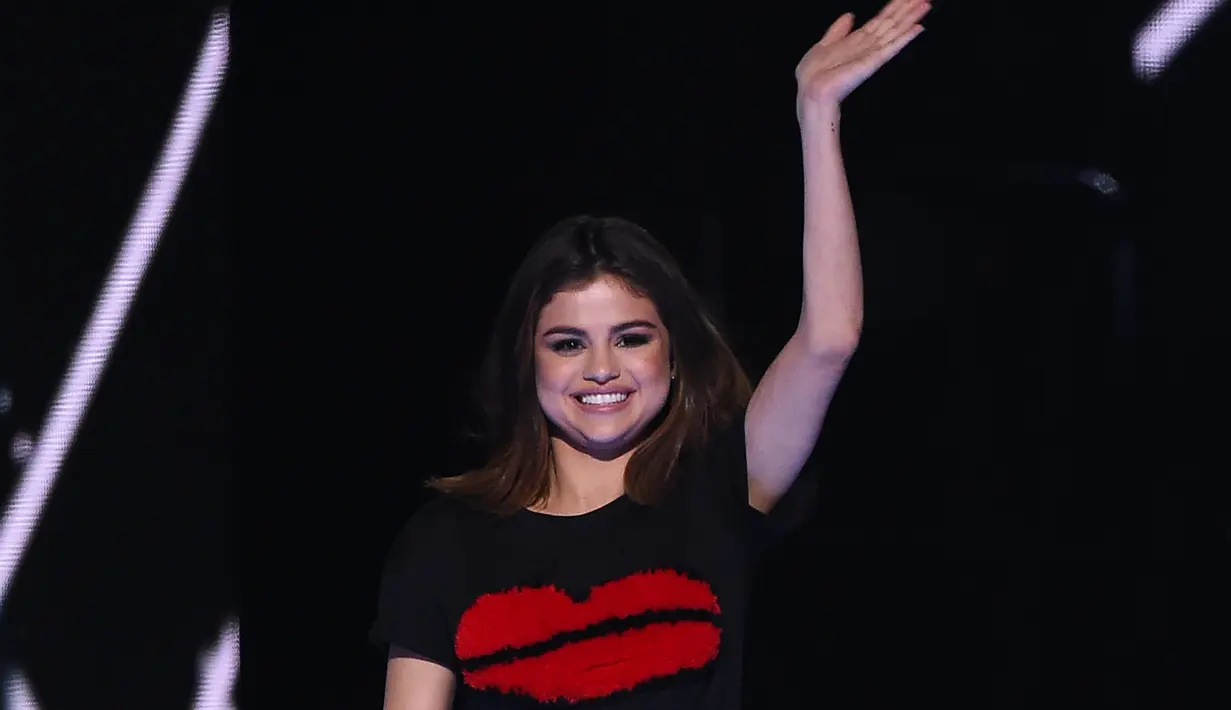 Justin Bieber dan Selena Gomez memutuskan berpisah tak lama setelah pernikahan ayah Justin. (ROBYN BECK  AFP)