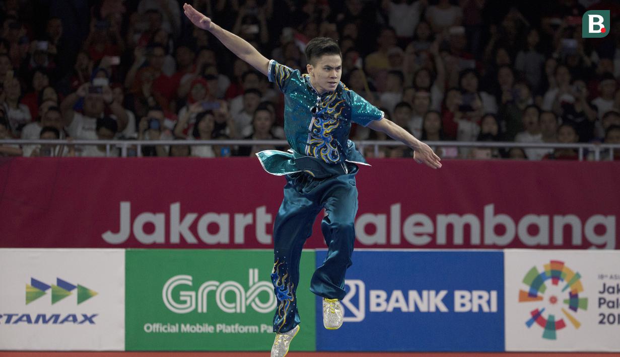 Atlet Wushu, Edgar Xavier, saat beraksi pada nomor Cangquan putra Asian Games di JIExpo, Jakarta, Minggu, (19/8/2018). Edgar Xavier berhasil meraih perak dengan angka 9.72. (Bola.com/Vitalis Yogi Trisna)