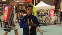 Ulul Albab El Ibrahim anak yang menjadi escort Cristiano Ronaldo pada pertandingan Timnas Portugal kontra Ghana di Piala Dunia 2022. (Hendry Wibowo/Bola.com)