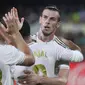 Penyerang Real Madrid, Gareth Bale berselebrasi usai mencetak gol ke gawang Villareal pada pertandingan La Liga Spanyol di stadion Ceramica (1/9/2019). Bale mencetak dua gol dan menyelamatkan Madrid dari kekalahan. (AP Photo/Alberto Saiz)