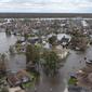 Jalan-jalan dan rumah-rumah yang terendam banjir terlihat setelah terjangan Badai Ida di subdivisi Spring Meadow di LaPlace, Louisiana, Senin (30/8/2021). Badai Ida ini sebagai salah satu badai paling kuat yang pernah melanda Amerika Serikat.  (AP Photo/Steve Helber)