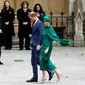 Meghan Markle dan Pangeran Harry saat hadir di Commonwealth Day Service 2020 di Westminster Abbey. (TOLGA AKMEN / AFP)