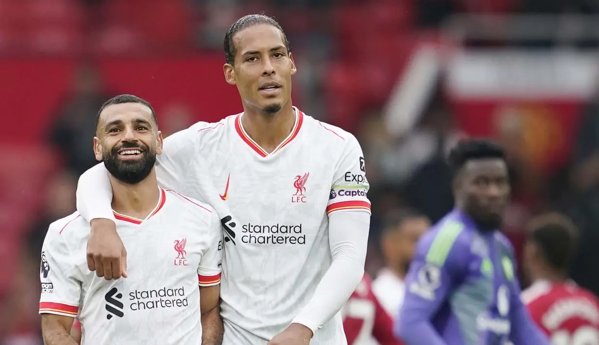 Manchester United menelan kekalahan dengan skor telak 0-3 dari sang rival abadi, Liverpool. Keduanya bertemu dalam laga pekan ketiga Premier League 2024/2025 di Old Trafford, Minggu (1/9/2024) malam WIB. (AP Photo/Dave Thompson)