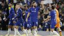 Striker Chelsea, Oliver Giroud, melakukan selebrasi usai membobol gawang PAOK Thessaloniki pada laga Liga Europa di Stadion Stamford Bridge, Kamis (29/11). Chelsea menang 4-0 atas PAOK Thessaloniki. (AP/Matt Dunham)
