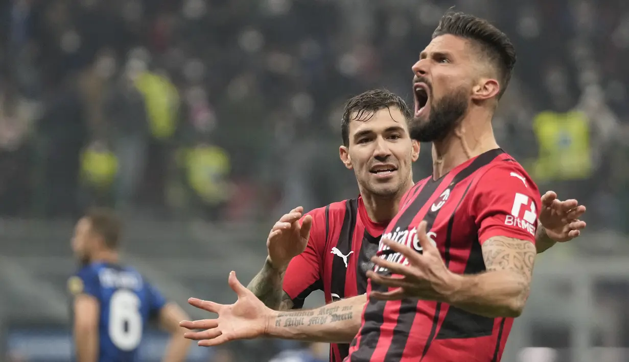 Olivier Giroud. Striker AC Milan berusia 35 tahun ini baru saja mencetak dua gol di laga debut Derby Milan melawan tuan rumah Inter Milan di pekan ke-24 Liga Italia musim 2021/2022 yang berkesudahan 2-1, 5 Februari 2022. Total 8 gol dan 2 assist dicetaknya hingga kini. (AP/Antonio Calanni)