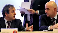 UEFA's French President Michel Platini speaks with deputy Chief Executive Italy's Gianni Infantino prior to the opening of an executive meeting at UEFA headquarters on December 11, 2008 in Nyon. AFP PHOTO / FABRICE COFFRINI 