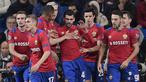 Para pemain CSKA Moskow merayakan gol yang dicetak Georgy Shchennikov ke gawang Real Madrid pada laga Liga Champions di Stadion Santiago Bernabeu, Madrid, Rabu (12/12). Madrid kalah 0-3 dari CSKA. (AFP/Javier Soriano)
