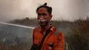 Kabut asap yang ditimbulkan oleh kebakaran itu bergerak menuju Palembang, Ibu Kota Provinsi Sumatra Selatan, sehingga menyebabkan kondisi udara tidak sehat bagi 1,7 juta penduduk kota tersebut. (Al ZULKIFLI/AFP)