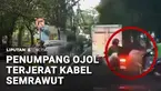 Kabel semrawut di Jakarta kian meresahkan. Seorang penumpang ojek daring terjerat kabel yang menjuntai di sekitar Perumahan Pejabat Negara, Widya Chandra, Kebayoran Baru, Jakarta Selatan.