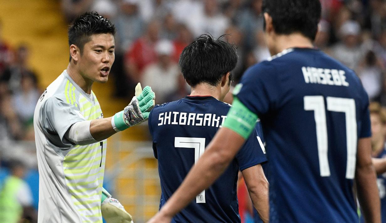 Eiji Kawashima pernah jadi ikon di bawah mistar gawang Timnas Jepang selama lebih dari satu dekade lamanya. Hingga pensiun dari panggung internasional pada 2022, ia mengoleksi total 95 caps bersama Timnas Jepang dengan torehan 36 kali nirbobol, total hanya kemasukan 104 gol saja. (AFP/Filippo Monteforte)