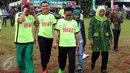 Ketua Umum PKB Muhaimin Iskandar (tengah) berjalan bersama ketua Fraksi DPR RI Ida Fauziyah (kanan) dalam acara HUT ke-17 Fraksi PKB di Kompleks Parlemen, Senayan, Jakarta, Kamis (6/10). (Liputan6.com/JohanTallo)