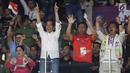 Presiden Joko Widodo bersama Ibu Iriana saat menyaksikan laga Final Bulutangkis Beregu Putra Asian Games 2018 antara Indonesia melawan China di Jakarta,Rabu (22/8). (Liputan6.com/Helmi Fithriansyah)