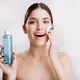 Seorang perempuan sedang membersihkan wajahnya menggunakan micellar water (Foto Dok: Freepik/lookstudio).