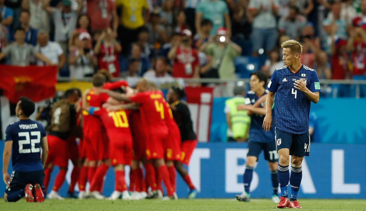 Jepang. Termasuk Piala Dunia 2022, Jepang telah lolos sebanyak 7 kali ke putaran final Piala Dunia. Dalam 6 edisi sebelumnya, 1998 hingga 2018, mereka mampu 3 kali lolos dari fase grup, yaitu di Piala Dunia 2002, 2010 dan 2018. Ketiganya mereka selalu kandas di babak kedua (16 besar). Pada edisi 2018, Jepang tersingkir di babak 16 besar usai kalah 2-3 dari Belgia. (AFP/Odd Andersen)