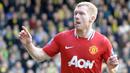 Paul Scholes merupakan salah satu pemain terbaik yang pernah dimiliki Manchester United. Gelandang legendaris tersebut pernah mencetak gol di usianya yang telah menginjak 37 tahun 9 bulan 30 hari saat mengalahkan Wigan Athletic dengan skor telak 4-0 di Liga Inggris 2012/2013. (AFP/Olly Greenwood)