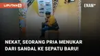 Tampak seorang pria sedang duduk sambil mencoba sepatu dari rak toko. Terlihat, ketika dia sudah merasa nyaman terhadap sepatu itu, gelagatnya berubah