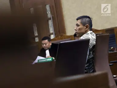 Pimpinan Tjokro Group, Kurniawan Eddy Tjokro saat menjalani sidang perdana kasus dugaan suap kepada Direktur PT Krakatau Steel, Wisnu Kuncoro di Pengadilan Tipikor, Jakarta, Rabu (12/6/2019). Sidang beragendakan mendengar pembacaan dakwaan dari JPU KPK. (Liputan6.com/Helmi Fithriansyah)