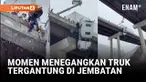 Badai musim dingin menyebabkan kecelakaan di West Virginia, AS, saat sebuah truk tergantung di tepi jembatan. Pengemudi berhasil diselamatkan tanpa cedera.
