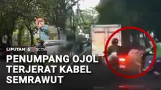 Kabel semrawut di Jakarta kian meresahkan. Seorang penumpang ojek daring terjerat kabel yang menjuntai di sekitar Perumahan Pejabat Negara, Widya Chandra, Kebayoran Baru, Jakarta Selatan.