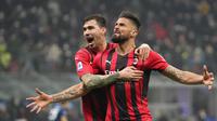 Striker AC Milan, Olivier Giroud, merayakan golnya ke gawang Inter Milan dalam lanjutan Liga Italia 2021/2022, Minggu (6/2/2022) dini hari WIB. (AP Photo/Antonio Calanni)