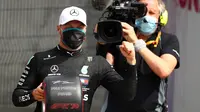 Pembalap Mercedes, Valtteri Bottas meraih pole position pada sesi kualifikasi Formula 1 (F1) 2020 di Sirkuit Silverstone, Inggris, Sabtu (8/8/2020). (Bryn Lennon / POOL / AFP)