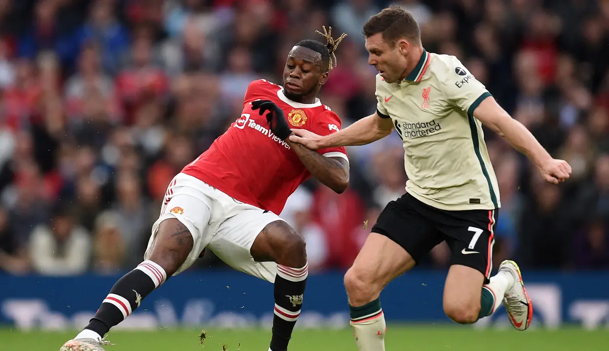 Aaron Wan-Bissaka. Mendapatkan poin 4,5. Tampil di bawah standar saat membantu pertahanan dan penyerangan. Namun ia tidak dapat disalahkan secara langsung dalam proses terjadinya kelima gol Liverpool ke gawang David De Gea. (AFP/Oli Scarff)
