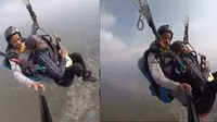 Menguji Adrenalin, Pria Ini Mainkan Ukulele dan Bernyanyi Saat Naik Paralayang