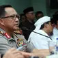 Kapolri Jenderal Pol Tito Karnavian (kiri) memberi keterangan di gedung MUI, Jakarta, Senin (28/11). Bersama MUI, Kapolri membahas aksi 2 Desember bersama Ketua Dewan Pembina GNPF-MUI, M Rizieq Shihab. (Liputan6.com/Helmi Fithriansyah)
