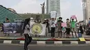 Sejumlah masyarakat yang tergabung dalam organisasi Lingkar Ganja Nusantara (LGN) Jakarta melakukan aksi yang bertajuk Selamatkan Hutan Indonesia pada Car Free Day di Kawasan Bundaran HI, Jakarta, Minggu (29/9/2019).  (Liputan6.com/Herman Zakharia)