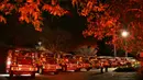 Ratusan truk Pemadam Kebakaran Hutan LAFD disiagakan untuk mengantisipasi meluasnya Kebakaran Palisades di lingkungan Encino di Los Angeles, California. (Patrick T. Fallon/AFP)