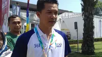 Legenda bulutangkis Indonesia, Taufik Hidayat, hadir dalam pawai obor Asian Games di Bandung, Sabtu (11/8/2018). (Bola.com/Muhammad Ginanjar)