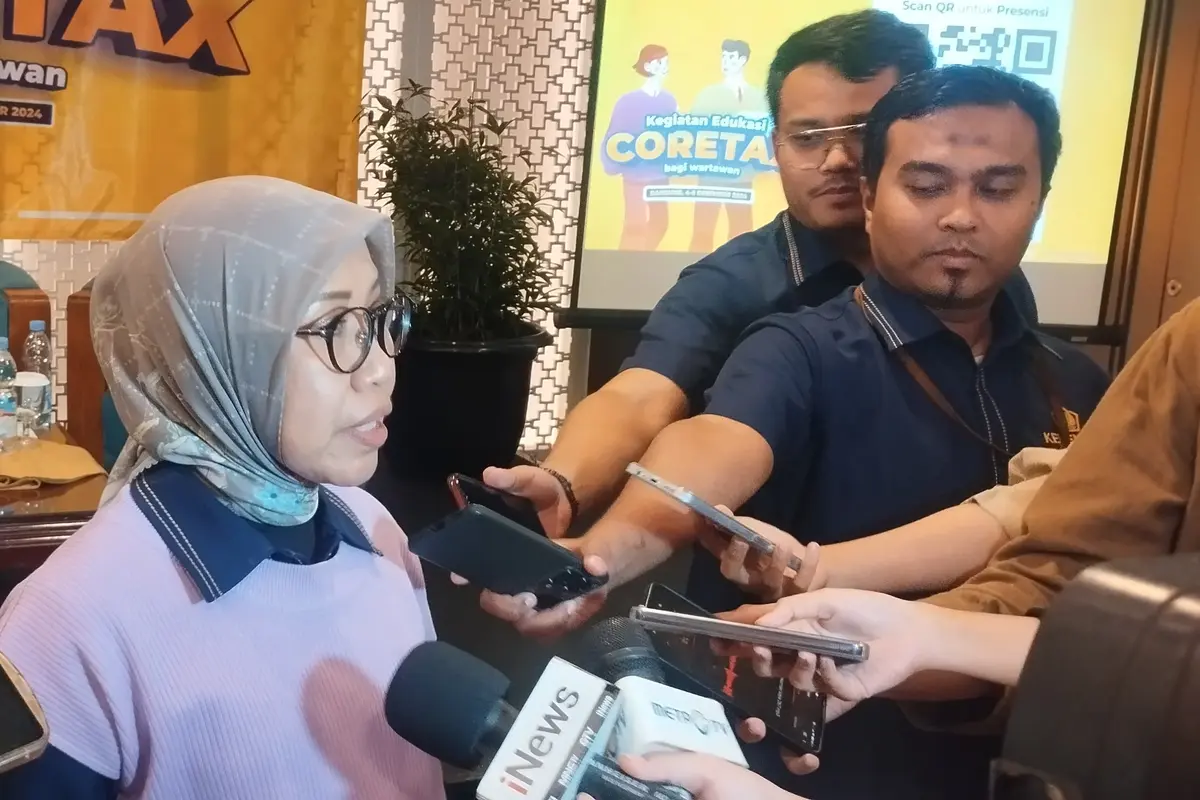 Direktur Penyuluhan, Pelayanan, dan Hubungan Masyarakat Direktorat Jenderal Pajak Dwi Astuti menjelaskan mengenai Coretax kepada wartawan, Rabu (4/12/2024). (Gagas/Liputan6.com)