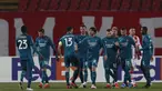 Para pemain AC Milan berselebrasi setelah pemain Red Star Belgrade Radovan Pankov mencetak gol bunuh diri pada pertandingan leg pertama babak 32 besar Liga Europa di Rajko Mitic Stadium di Beograd, Serbia, Jumat (19/2/2021). AC Milan bermain imbang atas Red Star 2-2. (AP Photo/Darko Vojinovic)