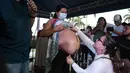 Seorang ibu hamil mengikuti kontes La Madre Panza (Perut Ibu) untuk merayakan Hari Ibu di Managua, Nicaragua, 30 Mei 2022. Kontes Perut Ibu terdiri dari pemberian hadiah kepada ibu hamil dengan perut terbesar. (OSWALDO RIVAS/AFP)