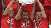 Tiga pemain senior Bayern Munchen, Arjen Robben, Rafinha, dan Franck Ribery, memutuskan pergi pada akhir musim ini. (AFP/Christof Stache)
