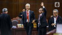 Pasangan Calon Presiden dan Calon Wakil Presiden nomor urut 3 Ganjar Pranowo-Mahfud Md datang ke ruang sidang Mahkamah Konstitusi (MK) di Jakarta, Rabu (27/3/2024). (Liputan6.com/Angga Yuniar)