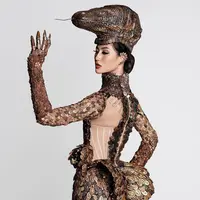 Puteri Indonesia 2020, Ayu Maulida, memakai kostum nasional bertema komodo untuk ajang Miss Universe 2020. (dok. Instagram @officialputeriindonesia/https://www.instagram.com/p/CO1VP58l-yP/)