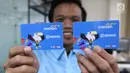 Karyawan menunjukkan e-Money edisi Asian Para Games 2018 di unit produksi kartu, Jakarta, Rabu (3/10). E-money edisi terbatas ini akan dapat diperoleh di booth Bank Mandiri yang ditempatkan di venue APG. (Liputan6.com/Angga Yuniar)