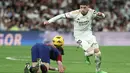 <p>Dengan kemenangan ini, Real Madrid semakin kokoh di puncak klasemen dengan raihan 81 poin. (Thomas COEX / AFP)</p>